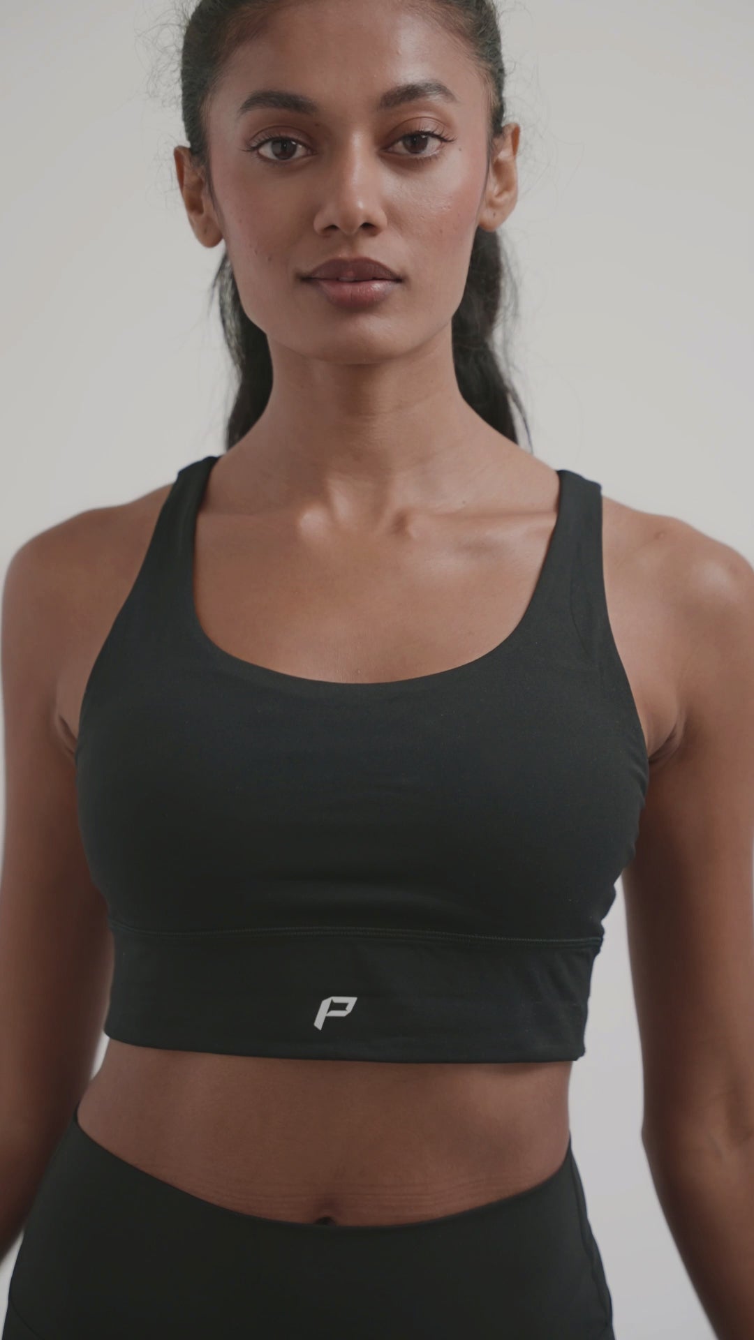 Load video: PilaNova Criss Cross Back Top–Built-In Support &amp; Chic–Black